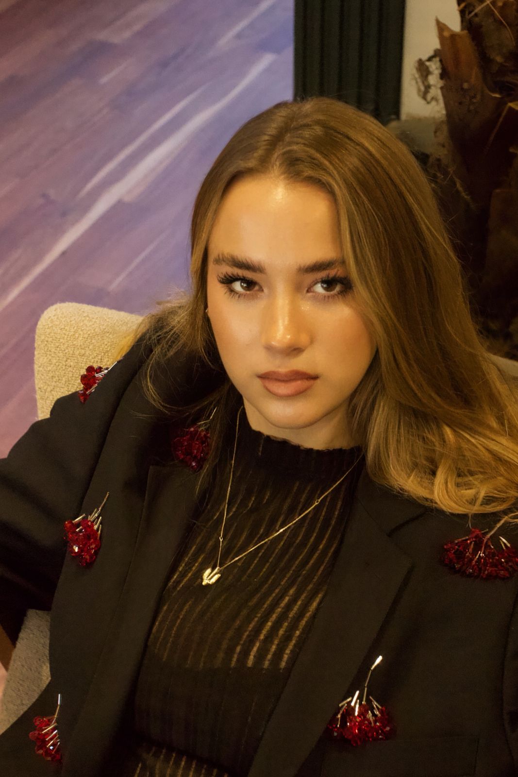 Close portrait of the model looking straight at the camera